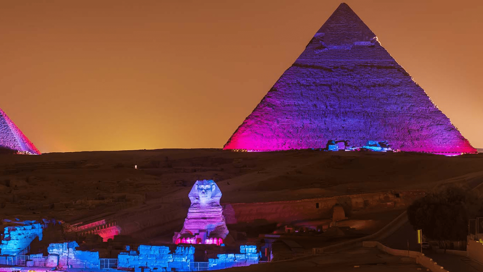 Illuminated Pyramids of Giza at night for a New Year holiday in Egypt