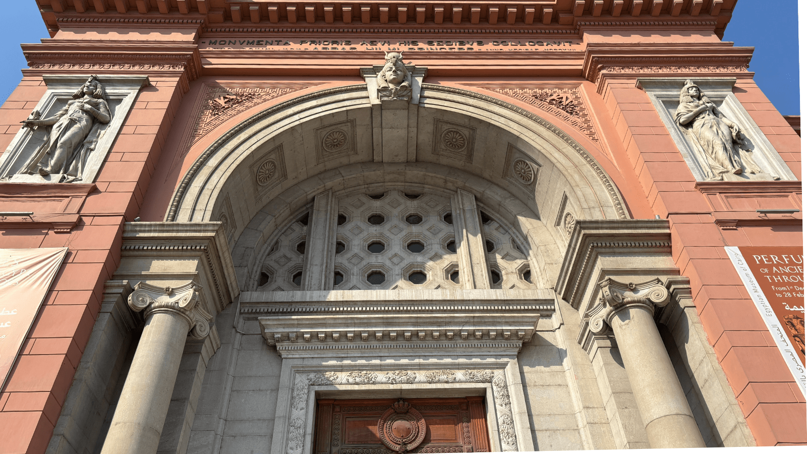 Historic pink facade and main entrance of the Egyptian Museum in Tahrir Square