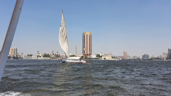 Felluca ride in the Nile river during the sunset.